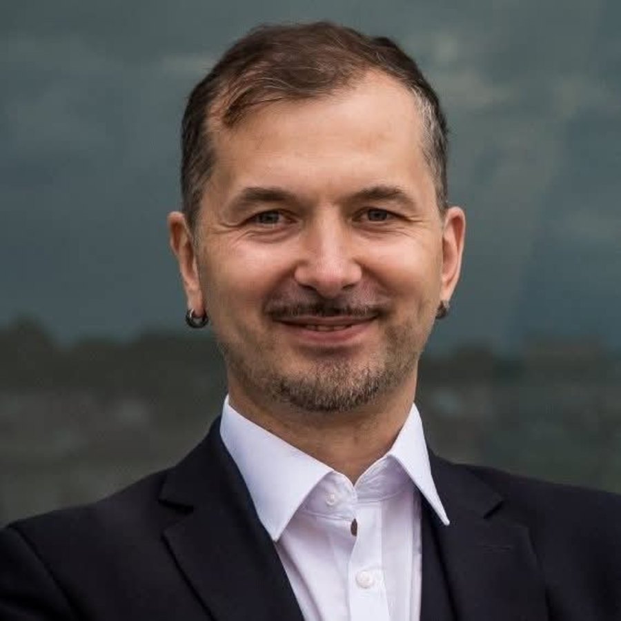 Portrait of Kestutis "Kes" Tauckela, founder of IQ256.